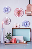 DIY paper rosettes as wall decoration