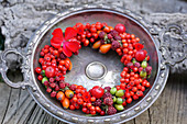 Wreath of berries in vintage dish