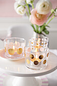 Glasses for tea lights decorated with gold dots