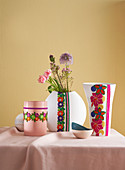 Flower vases decorated with trims