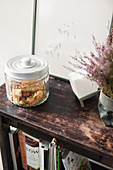 Cookies in glass jar on wooden shelves