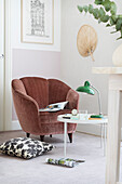 Reading place with upholstered armchairs and round table in the corner of the room