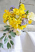 Spring bouquet with daffodils, tulips, scabiosa, and ranunculus