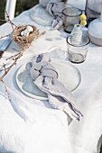 Place setting with linen napkin on Easter table