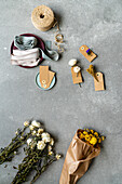 Flowers, paper tags, decorative ribbons and twine
