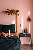 Breakfast in bed in bedroom with pink wall