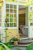 Door leading from summer garden into Swedish-style conservatory