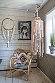Boho seating area with a hanging macramé lampshade