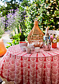 Round coffee table with Moroccan tablecloth on terrace