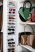 Bags and sunglasses in wardrobe