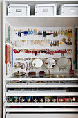 Jewellery collection and vanity mirrors in wardrobe