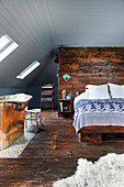Copper bathtub in rustic bedroom