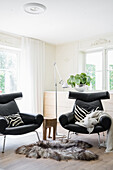 Seating area with black leather designer chairs