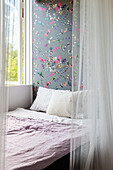 Sleeping area with tulle curtain in girl's bedroom