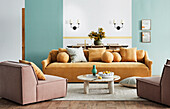 Upholstered furniture with throw pillows and coffee table in the living room