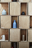 Vases on wooden shelves