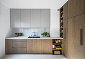 Custom-made kitchen with wooden fronts and grey fronts