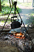 Kettle over campfire