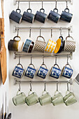 Kitchen railing with hooks to hang coffee cups from