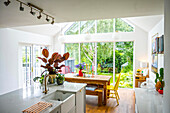 Bright kitchen with dining area and garden view