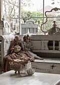 Antique dolls on vintage wooden bench