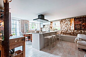 Kitchen with rustic elements and exposed stonework