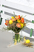 Easter bouquet of tulips, ranunculus and narcissus