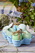 Pastel Easter eggs in an egg carton