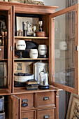 Antique apothecary cabinet with decorative objects