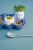 Easter decoration and breakfast egg in egg box