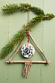 DIY winter decoration made from twigs and seeds enclosed in coconut oil