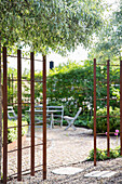 Metal trellis with rust, view of seating area