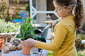 Girl gardening on garden table