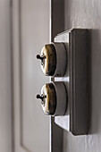 Original brass light switches in Georgian home.