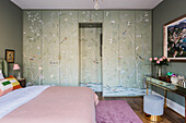 Chinoiserie wall paper covering wardrobe doors