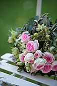 Bouquet of roses, hellebores and viburnum