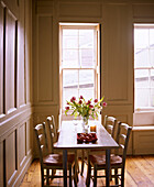 Wood table and chairs in country style dining room