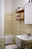 Cream tiled 1950s bathroom in 20th century Stockholm apartment