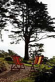 Striped deckchairs in grounds of Devon country home