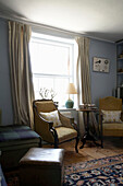 Seating area at sunlit window of Rye living room, Sussex