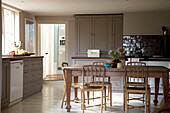 Wooden kitchen table and built in storage cupboards in Rye, Sussex