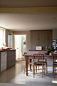 Wooden table with built in kitchen storage units in Rye, Sussex