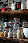 Storage jars on wooden shelf