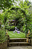 Child's tricycle in back garden of London home