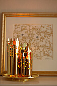 Golden Christmas decorations and gilt framed artwork