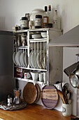 Metal kitchen storage above workbench