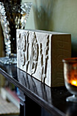 Carved stone ornament on mantlepiece of Brighton home, UK
