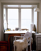 Desk with white painted chair in window Stockholm Sweden