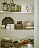 Detail of white shelves with crockery