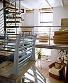 Open plan upper floor sitting room with spiral stairs